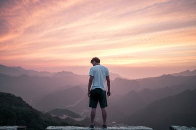 standing on top of a building